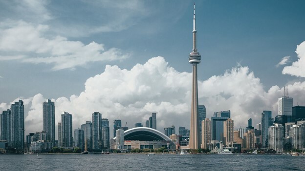 The image shows a view of Toronto skyline from the Toronto Island